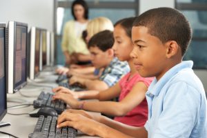 image of Elementary school students with computers
