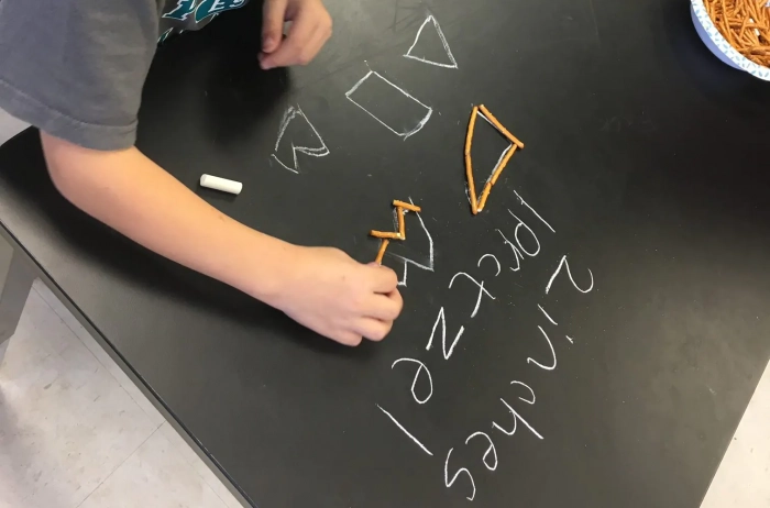 Kids making art with food and learning measurements.